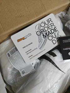 A packed order as it arrived, with the Swag Mode thank-you card on top