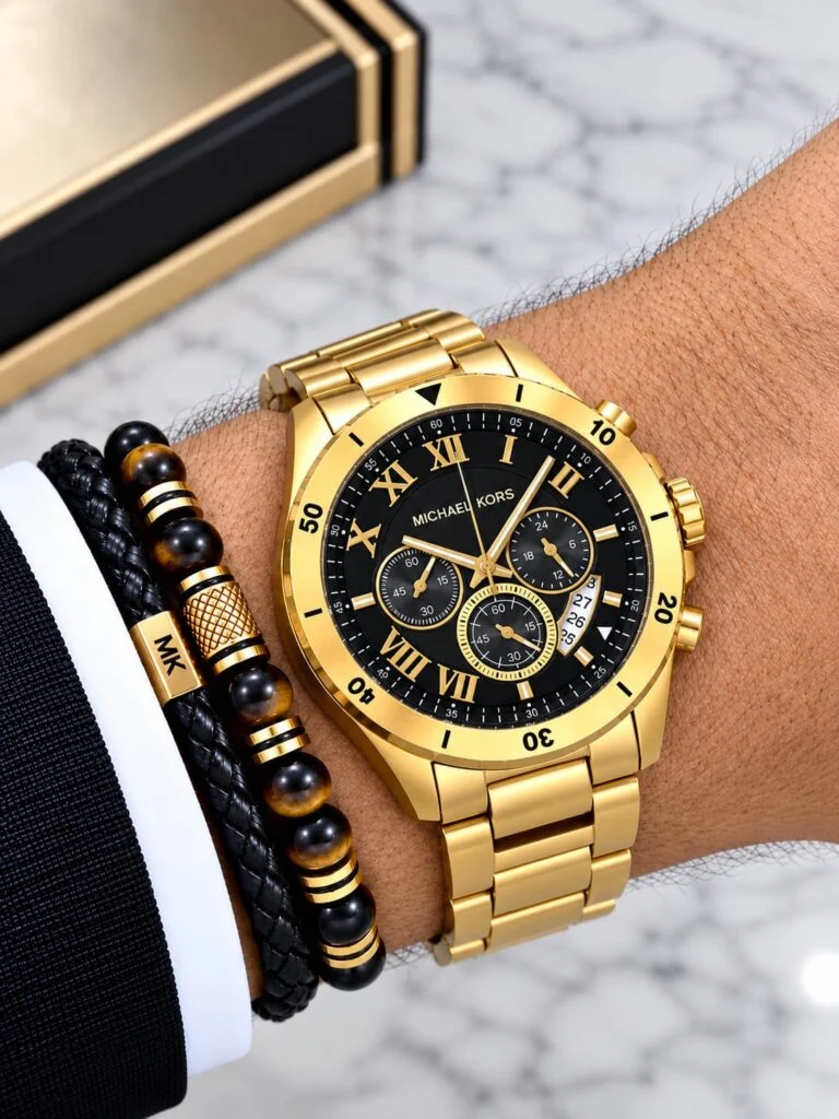 Gold-tone 45mm chronograph watch with a black Roman-numeral dial and steel bracelet