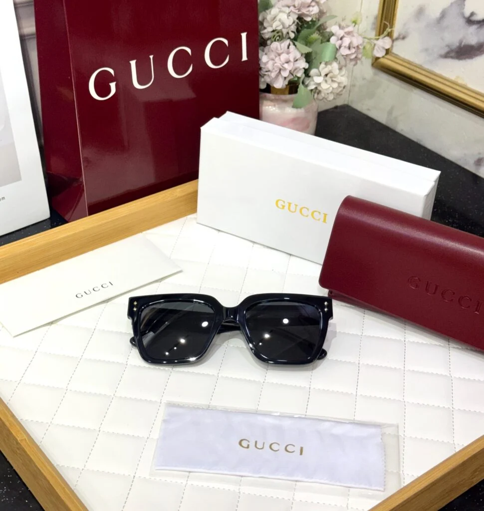 Black square acetate sunglasses with case and packaging