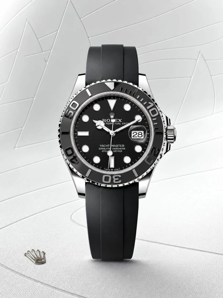 Automatic watch with a black dial and rotating bezel, studio view